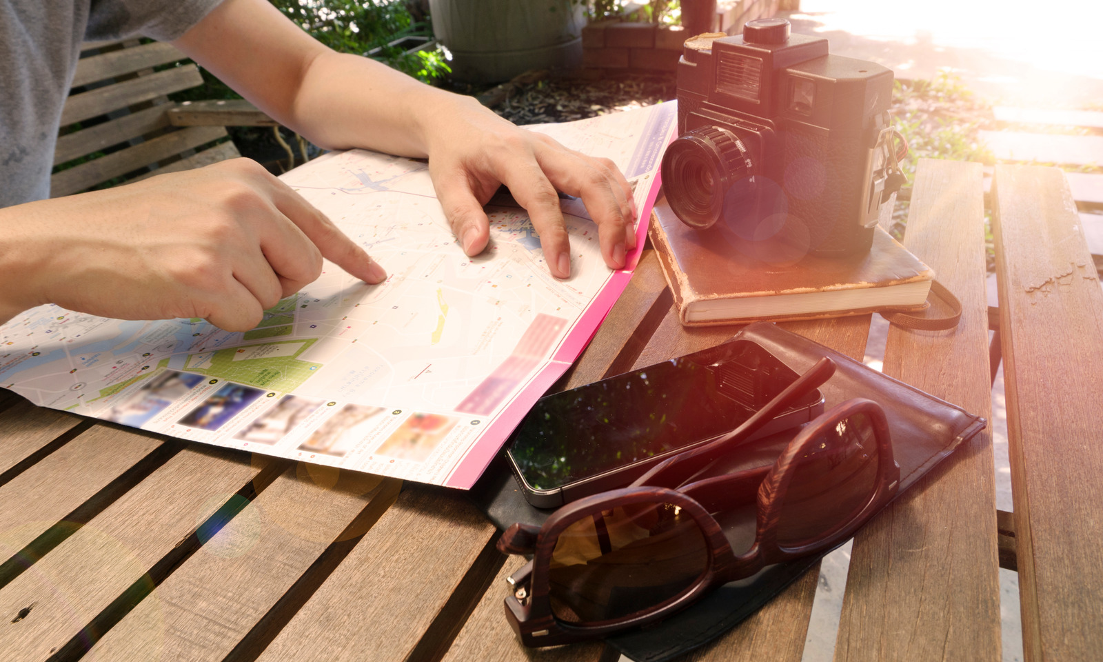 canva_-_man_traveler_is_looking_for_somewhere_on_local_map_while_is_re.jpg